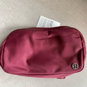 Lululemon  Everywhere Belt Bag.. burgundy new with tags